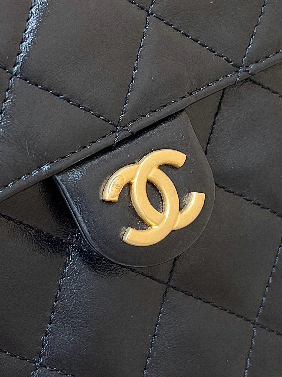 Chanel 25 Handbag in Black 40 Grained Calfskin Gold Hardware