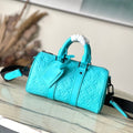 Louis Vuitton Keepall Bandoulière 25 in Turquoise Blue Monogram Embossed Calfskin Bag