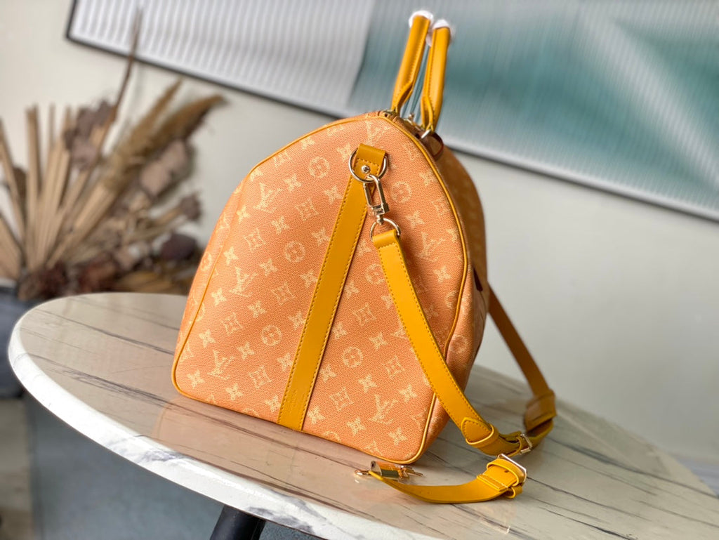 Louis Vuitton Keepall Bandoulière 55 in Orange Monogram Heritage Canvas Bag