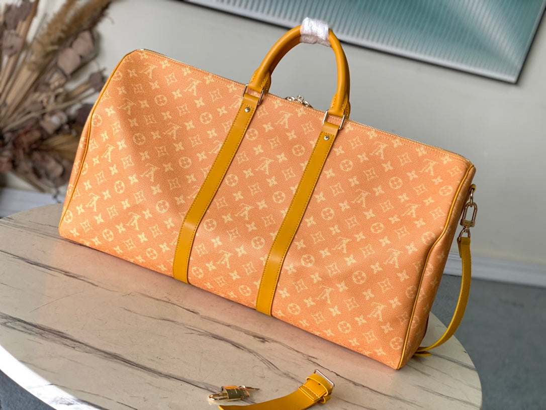 Louis Vuitton Keepall Bandoulière 55 in Orange Monogram Heritage Canvas Bag