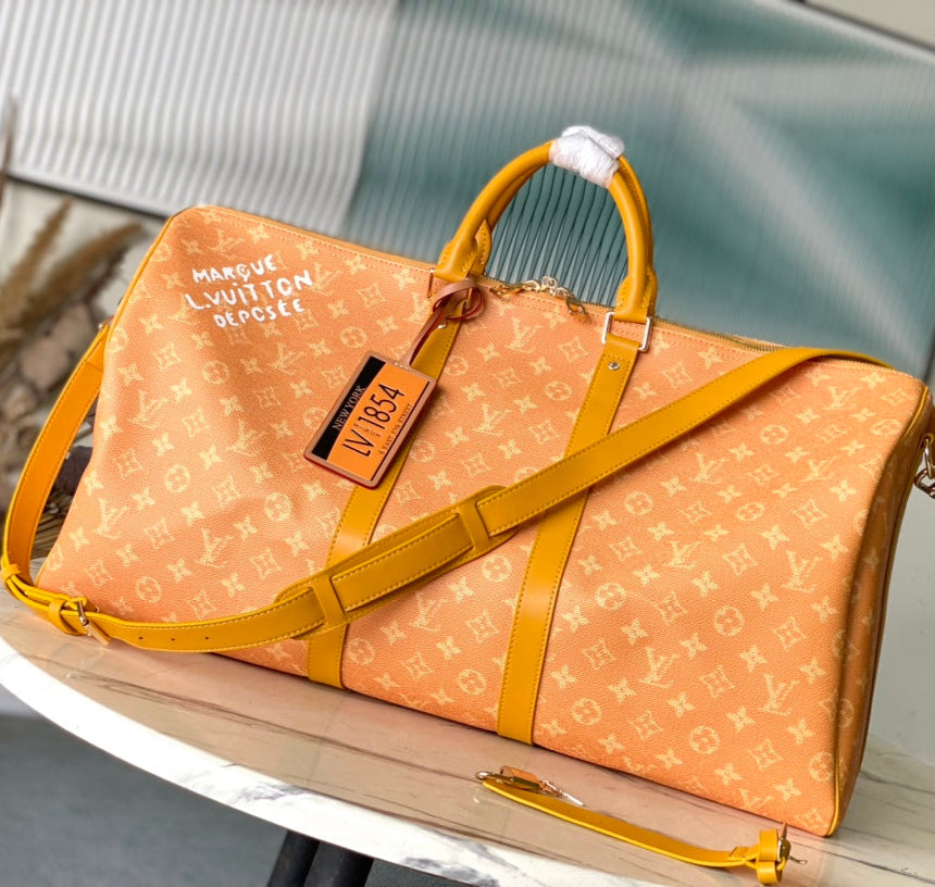 Louis Vuitton Keepall Bandoulière 55 in Orange Monogram Heritage Canvas Bag
