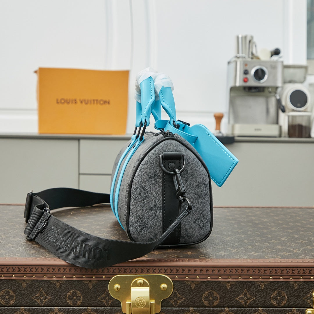 Louis Vuitton Keepall Bandoulière 25 in Gun Metal Monogram Eclipse Canvas Mix Turquoise Calfskin Bag