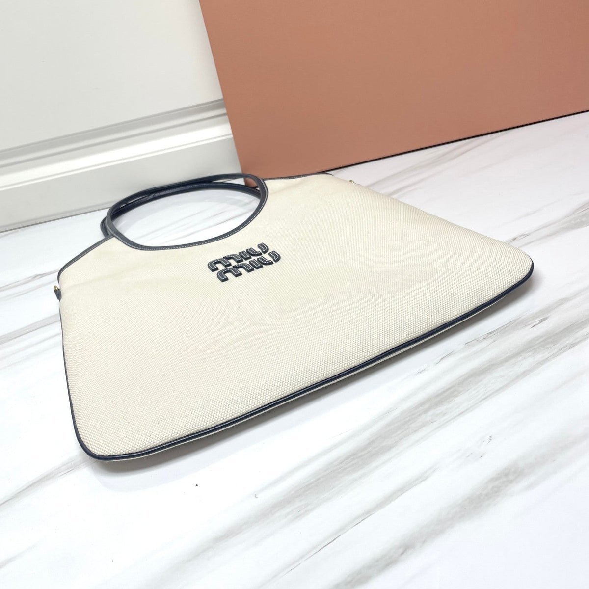 Ivy Tote Bag 40 in White Canvas and Navy Leather Trim