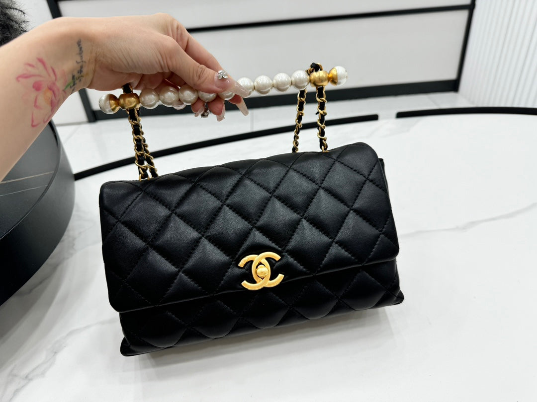 Chanel 25S Flap Bag 23 cm in Black Lambskin with Pearl Top Handle