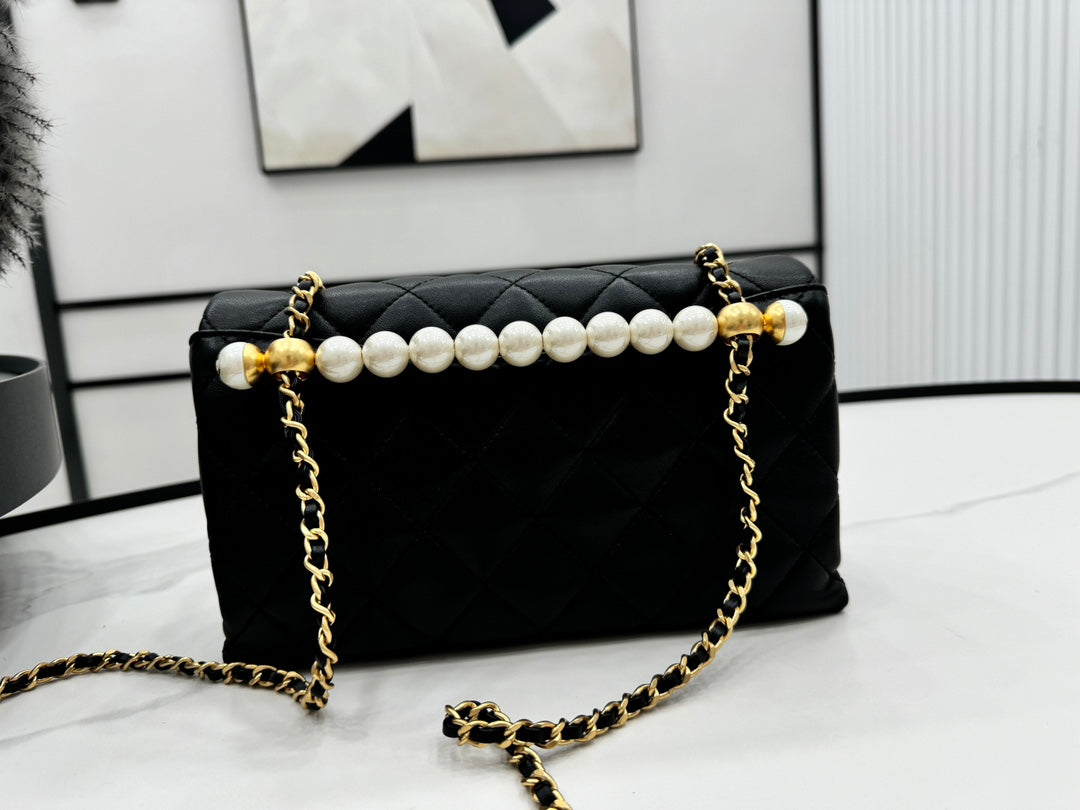 Chanel 25S Flap Bag 23 cm in Black Lambskin with Pearl Top Handle