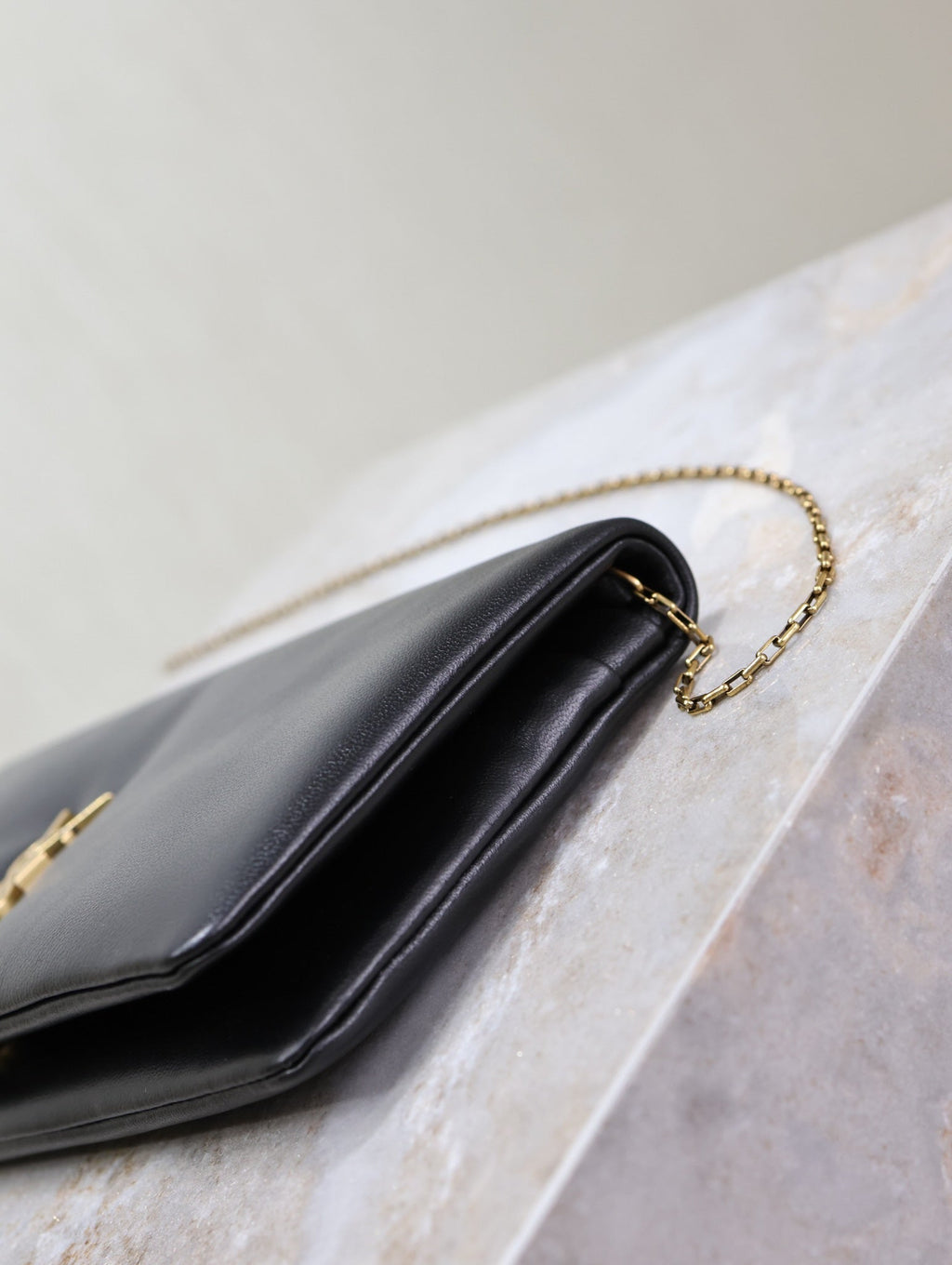 Saint Laurent Calypso Pouch 24 in Black Lambskin Gold Logo